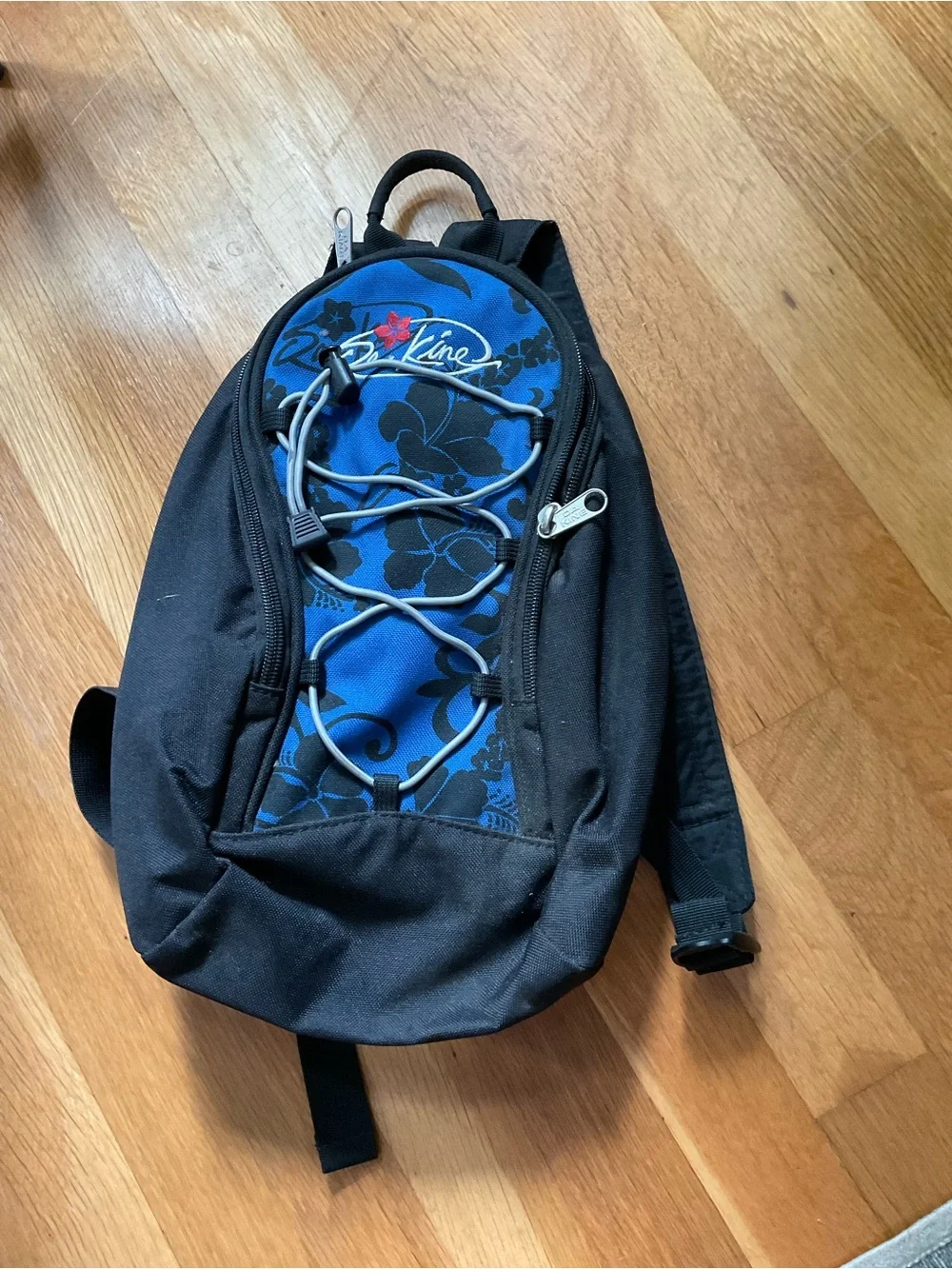 Dakine Blue and Black Sling Backpack with Front Bungee